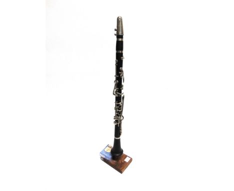 A CLARINET  complete with mouth-piece and reeds, uncased. 