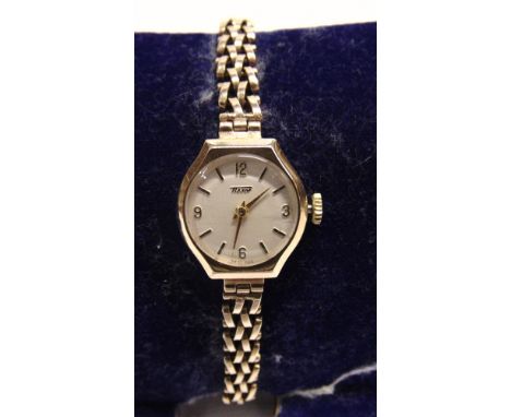 TISSOT, A LADY'S 9 CARAT GOLD MECHANICAL WRIST WATCH  on a bracelet, 13g gross