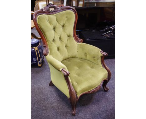 A Victorian button back library chair