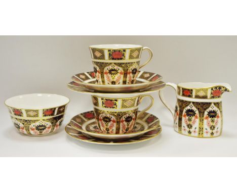 Royal Crown Derby 1128 pattern - two teacups, saucers and teaplates; sugar bowl; milk jug.