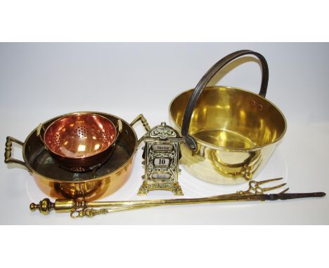 Copper and brass - a two handled pan; a jam pan; a desk calendar; a small colander; a toasting fork; a poker. 