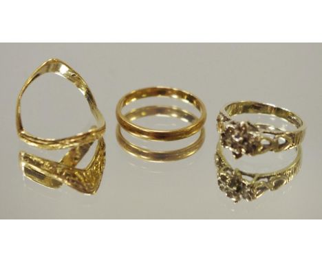 A 9ct gold wedding band; a 9ct gold double wishbone ring; a 9ct white gold ring set with diamond chips, gross weight 5.6g