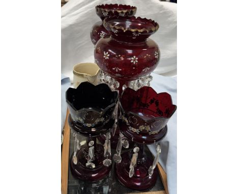 Two pairs of ruby glass table lustres with floral painted decoration together with a pottery jug