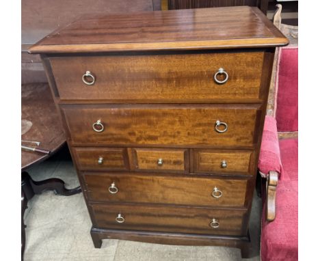 A stag chest with a rectangular top above two long drawers, three short and two further long drawers on bracket feet