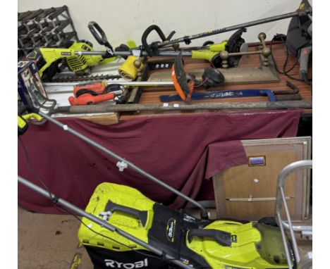A Ryobi 33cm mower together with Ryobi strimmers, a Stihl strimmer other tools, wine rack, carved panel etc, all the tools ar
