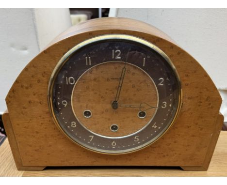 A walnut cased mantle clock 