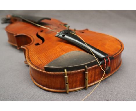 A three quarter size violin, with a two piece back and ebony stringing, bears a label El Tesoro, overall 55.5cm long, back no