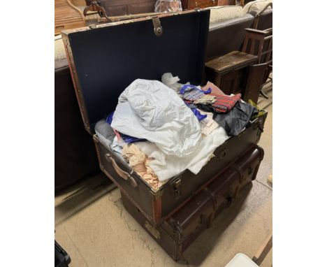 A trunk full of linen together with another trunk