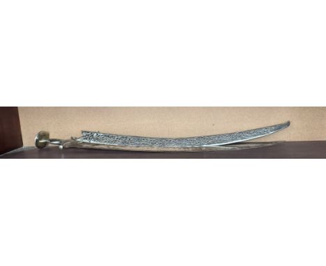 An Indian sword with a curved blade and pierced scabbard