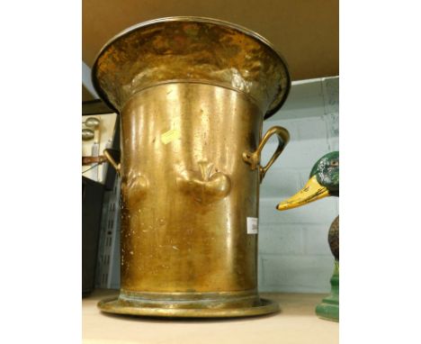 A hammered brass Art Nouveau two handled coal bucket and cover decorated with spades.