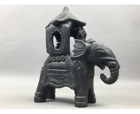 PAINTED STUCCO BUDDHISTIC FIGURE,25cm high, along with a 'Lord of the Rings' ring, Indian ceramic elephant, lacquered bowls a