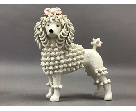 THREE DORIS DAWSON VINTAGE MODELS OF POODLES,the tallest 17cm high, along with other models of dogs