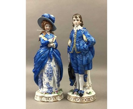 PAIR OF PORCELAIN FIGURES,of a male and female in vintage dress Some damage to the flowers, rubbing to the gilt.