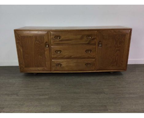 ERCOL WINDSOR ELM SIDEBOARD,69cm high, 156cm wied, 47cm deepWater damage to top, visible on images.No woodworm. Normal signs 