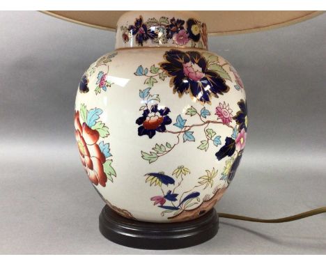 CERAMIC TABLE LAMP,with floral and gilt decoration, along with three other table lamps, a ceramic clock and other ceramics