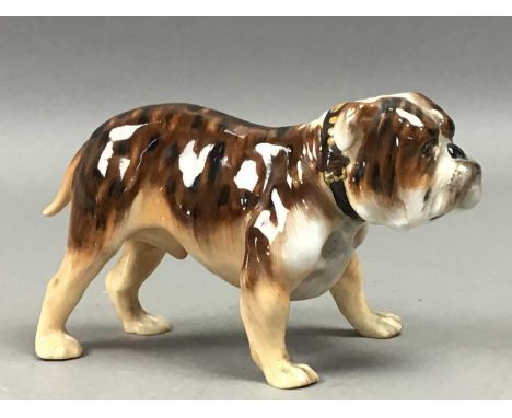 TWO ROYAL DOULTON BULLDOGS,including a brindle, 8cm high, along with another Royal Doulton bulldog and a larger Beswick bulld