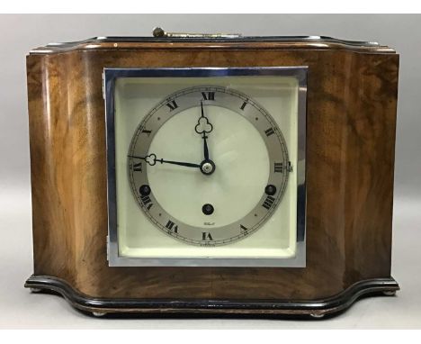 ELLIOT OF ENGLAND MANTEL CLOCK,21.5cm high, along with a barometer and minature binoculars (3)At the time of checking, the cl