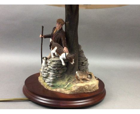 BORDER FINE ARTS TABLE LAMP,modelled with a farmer and his dog, 30cm high