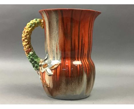 CLARICE CLIFF FOR WILKINSON 'MY GARDEN' JUG,with moulded handle, 19cm high, along with a blue and white ceramic biscuit barre