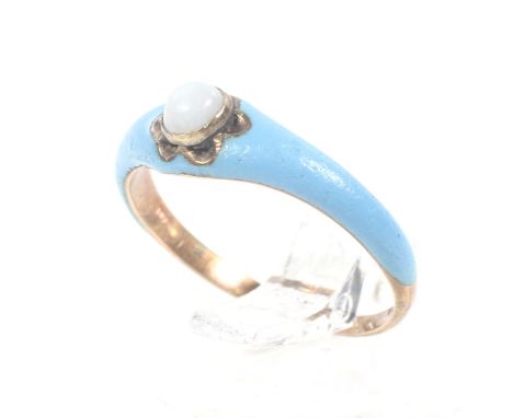 A mid-Victorian rose gold, opal and pale-blue enamel single stone ring. The round cabochon white opal rub-over set on a pale 