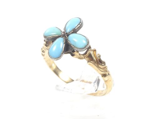 An early Victorian gold and turquoise quatrefoil flower-head cluster ring. The four drop-shaped cabochon turquoise rub-over s