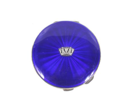 A silver and blue guilloche enamelled round compact with an applied Naval crown. The back engine turned, hallmarks forJohn Wi