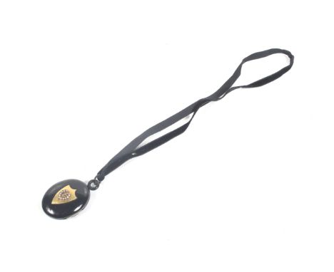 A late Victorian gold and half-pearl mounted jet locket. The oval jet two-piece locket with base metal hinge and internal fit