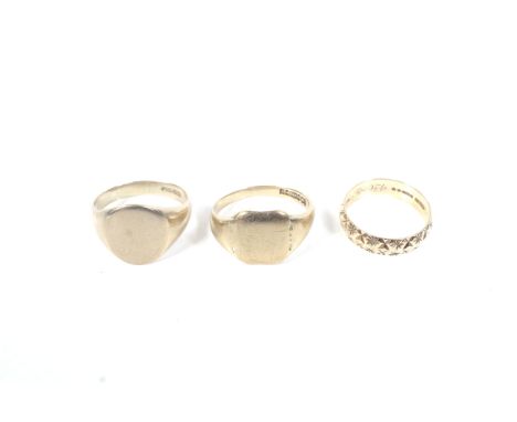 Two 9ct gold signet rings and a wedding band. Comprising; an oval signet ring, partial Sheffield hallmarks, the date letter o