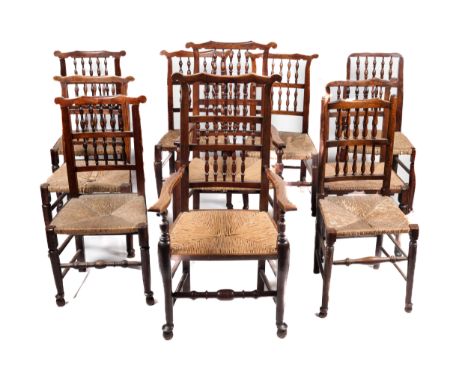 A set of ten 19th century oak ladder back dining chairs. Comprising eight (seven plus one matched) and two carver chairs, wit