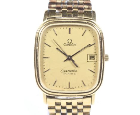 Omega, Seamaster Quartz, a mid size gold-plated and stainless steel oblong bracelet watch. The brushed golden dial with raise