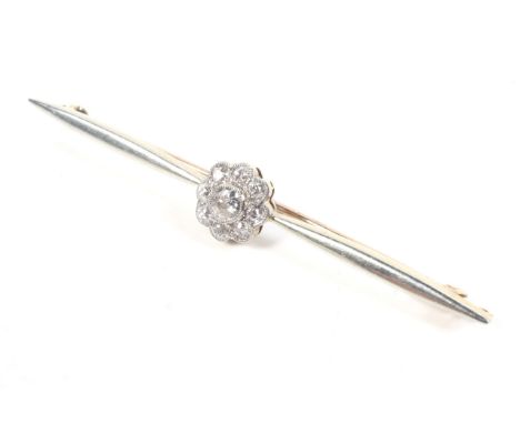 An early 20th century gold and diamond cluster bar brooch. The nine old-cut diamonds approx. 0.50cts total, all grain and mil