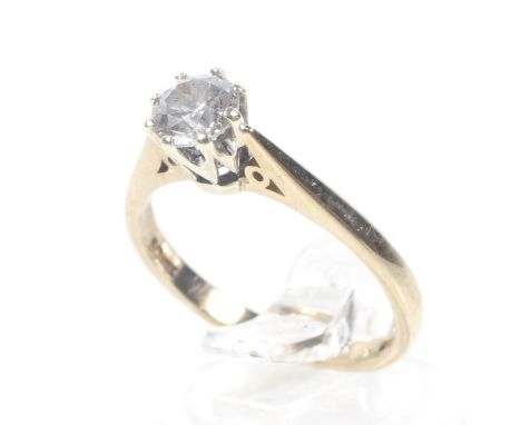 A vintage 9ct white and yellow gold and diamond solitaire ring. The round brilliant approx. 0.50cts, claw set in white on a y