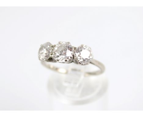 A mid-20th century diamond three stone ring. The transition cut stones approx. 0.59cts, 0.82cts & 0.67cts (approx. 2.08cts to