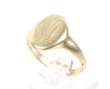 An Edwardian 18ct gold signet ring. The small oval head engraved with a monogram, between tapering shoulders on a D-section s