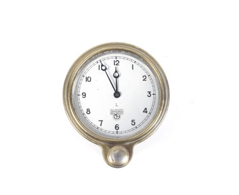Automobilia - A Smiths L brass cased dashboard clock with silvered dial and winder under. Diameter 9cm