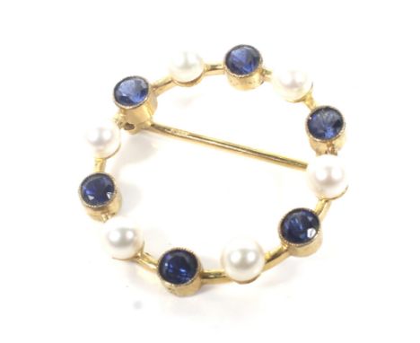 A vintage 9ct gold, sapphire and cultured-pearl open circlet brooch. Alternately rub-over set with six small round mixed-cut 