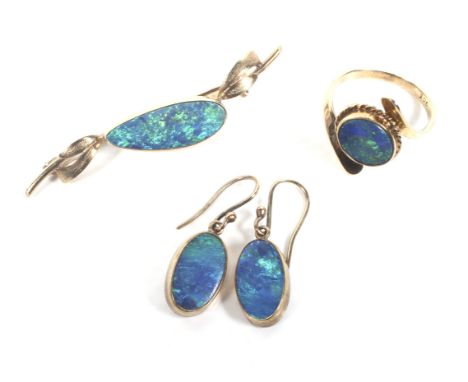 A collection of gold and black-opal-doublet jewellery to include a single stone ring. The oval-doublet approx. 10mm x 8.6mm, 