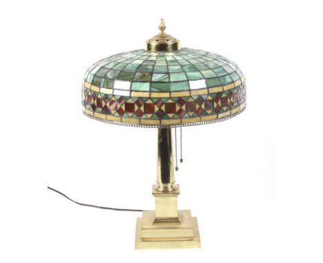 A 1922 gilded Tiffany style table lamp. In the form of a Doric column on a two step square base, with three P & S light fitti