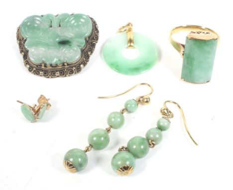 A small collection of jadeite jewellery including a ring. The rectangular domed panel approx. 19.8mm x 12mm, set on a scroll 