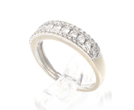 A modern 18ct white gold and diamond three row half-eternity ring. The graduated round brilliants approx. 0.38cts total, all 