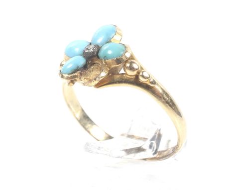 A Victorian gold, turquoise and diamond flower-head cluster ring. Centred with a small rose diamond within four (of five)turq