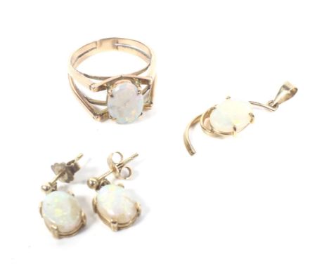 A small collection of gold and white opal jewellery to include a single stone ring. The oval cabochon displaying a pleasing p