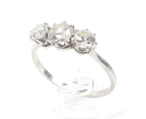 An early-mid 20th century diamond three stone ring. The old-cut and transition-cut stones approx. 1.30cts, claw set on a D-se