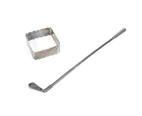 A silver straw in the form of a golf club and a square napkin ring. The golf club with hallmarks for William Manton, Birmingh