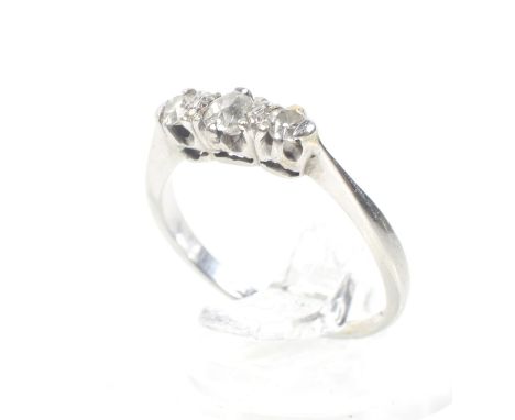 An early-mid 20th century white gold and diamond three stone ring. The graduated old-cut & old-mine stones approx. 0.30cts, c