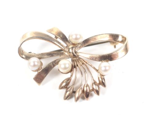 A vintage 9ct gold and cultured-pearl four stone floral-bud and ribbon-bow brooch. Hallmarks for Birmingham 1960, later base 