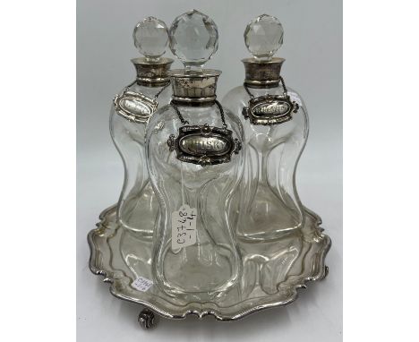 Three silver necked decanters Birmingham 1905, maker Elkington &amp; Co. Ltd together with three silver decanter labels, Gin,