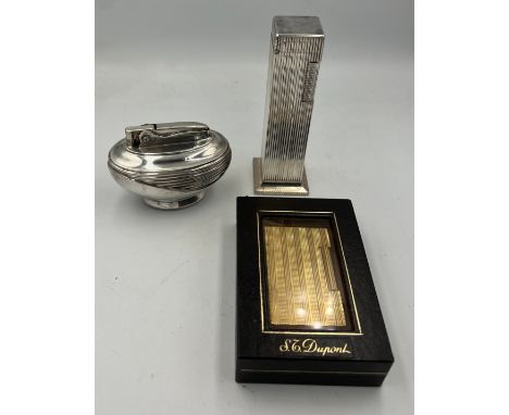 Three lighters to include DuPont gold plated lighter in original box, Lord De Luxe column silver plated table lighter and a R