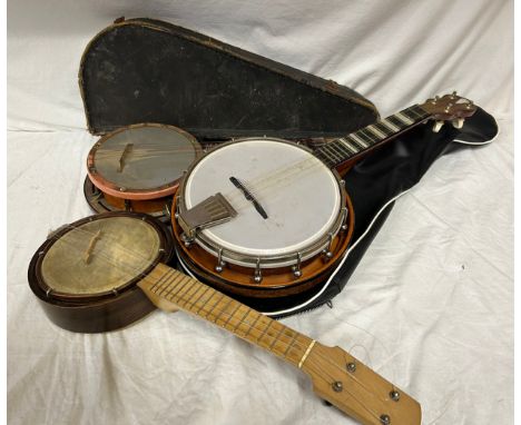 Three ukulele banjos to include a rosewood made in the G.D.R. and a Melody Maker Selcol, Made in England. Two with cases. Tog