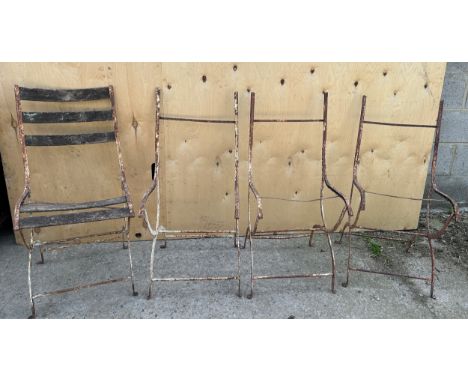 A set of four vintage metal cafe chairs. 